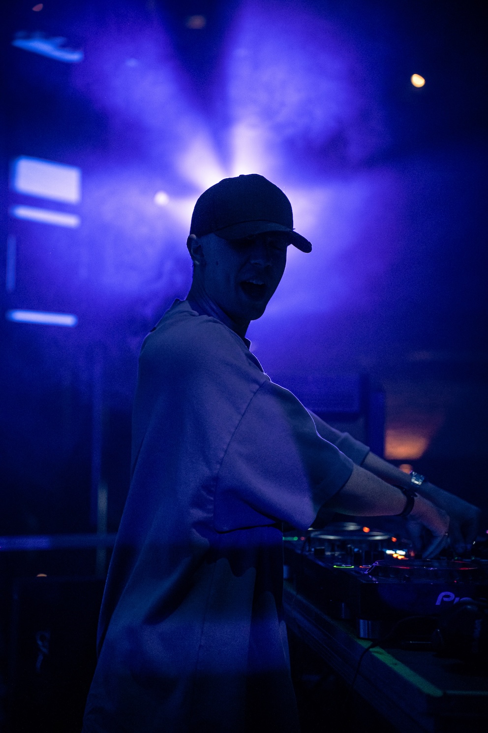 DJ silhouette against stage lights